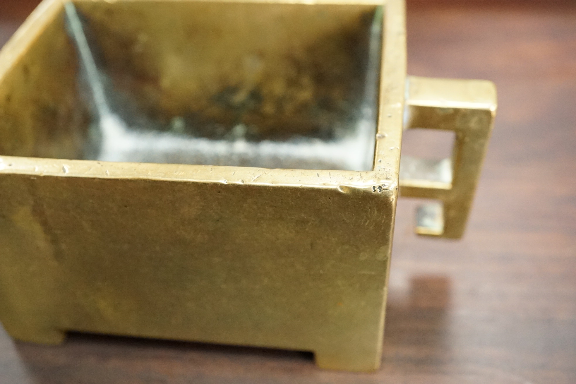 A Chinese bronze rectangular censer, fangding, Xuande mark, 18th century